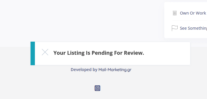 The image displays a notification message that reads, "Your Listing Is Pending For Review," indicating that a submitted business listing is awaiting approval. Below the message, there is a small note, "Developed by Mail-Marketing.gr," with an Instagram icon, suggesting that the development of the platform or site may have been managed by this company.